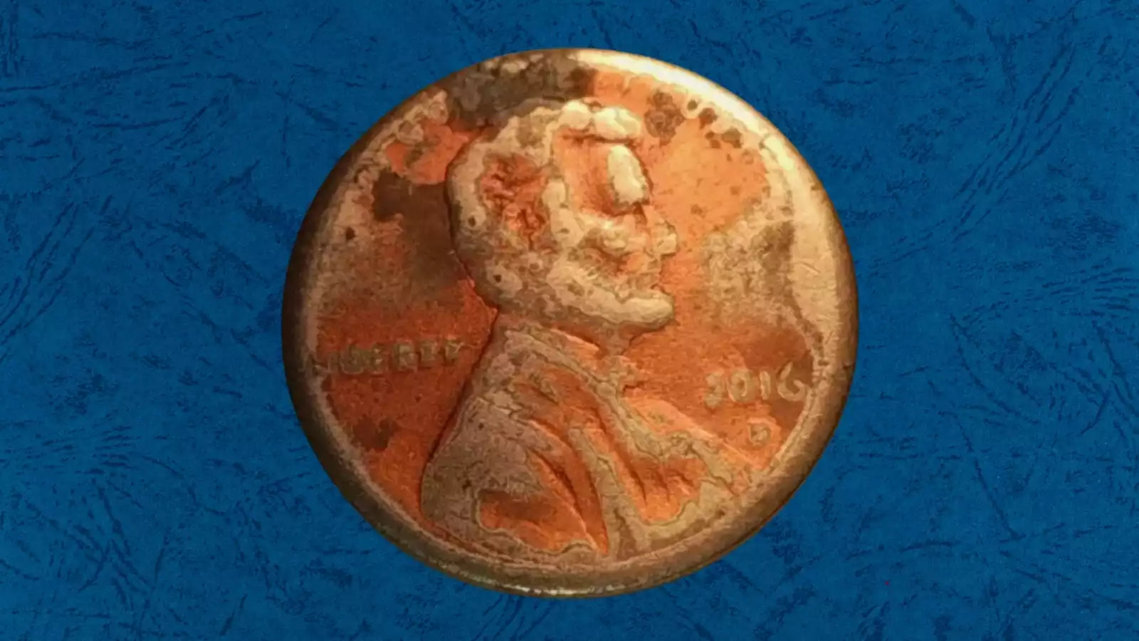 2016 penny broad strike error showing coin wider than normal with flat rim due to striking outside the collar